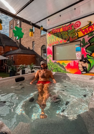 Summer 2025 Boy inside a jaccuzi enjoying a sunny day in Gardiner House Hostel in Dublin